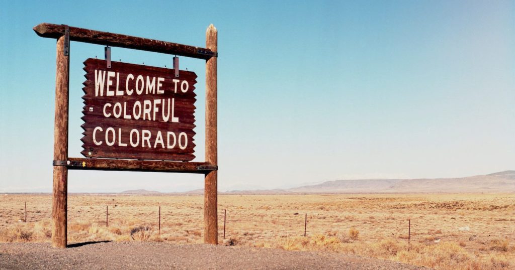 roadside sign - "Welcome to Colorful Colorado" - Wells + Associates website